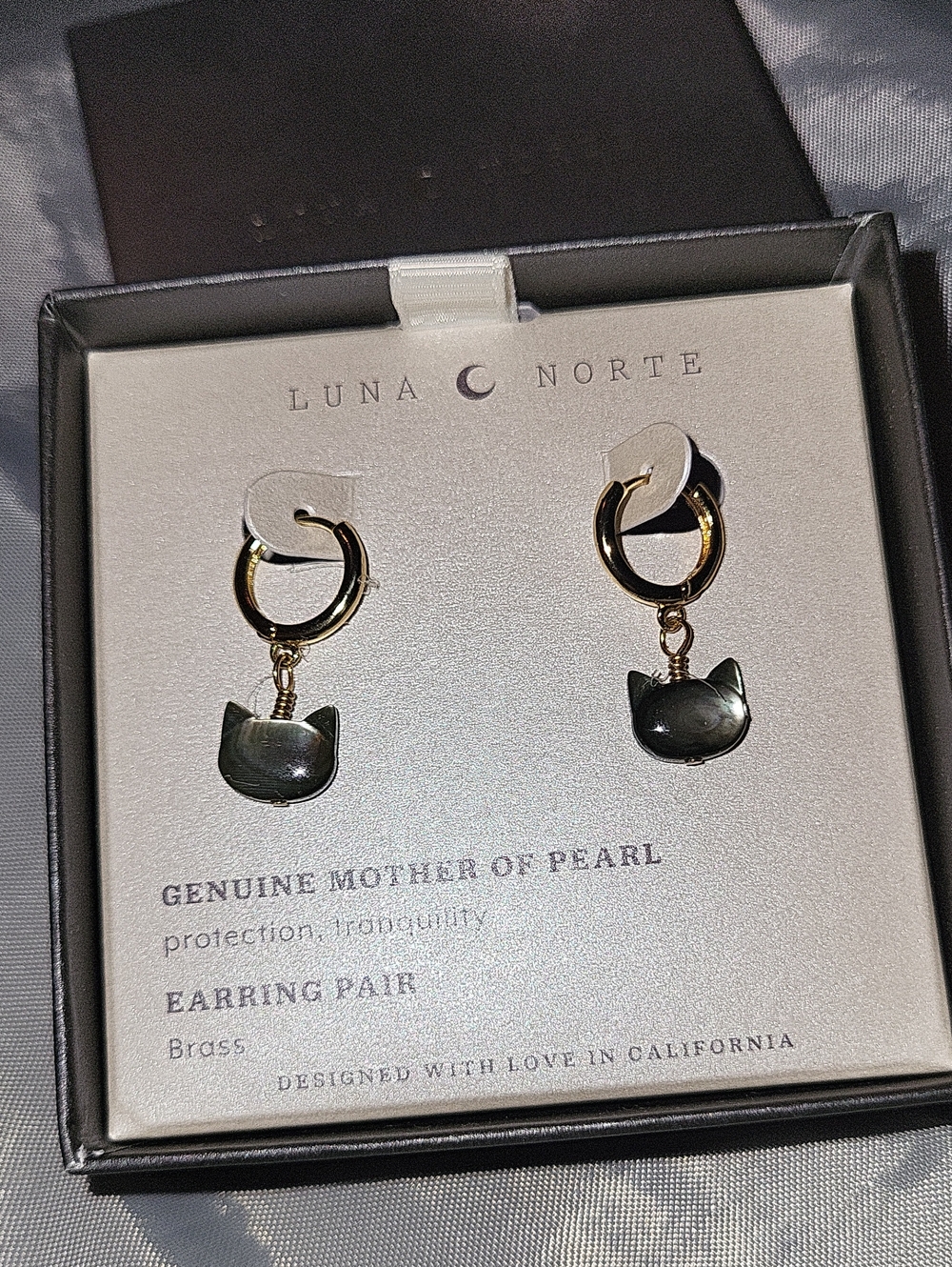 Luna Norte Gold Huggie Hoop Earrings with Black Mother-of-Pearl Cat Charms TL M